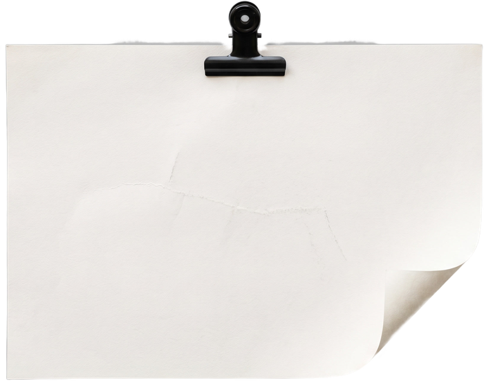 A blank sheet of paper held by a bulldog clip
